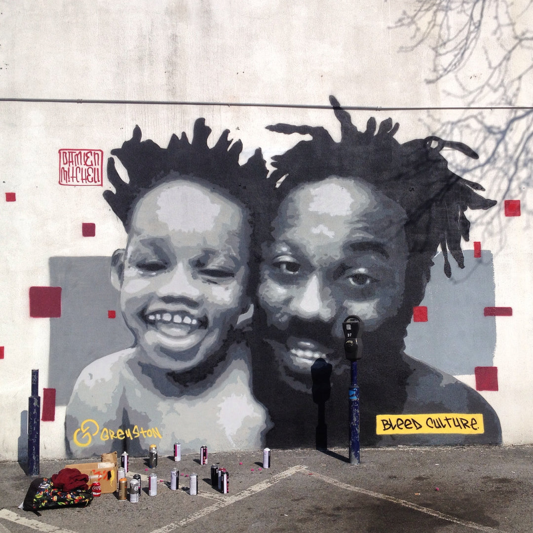 spray paint mural of a father and son